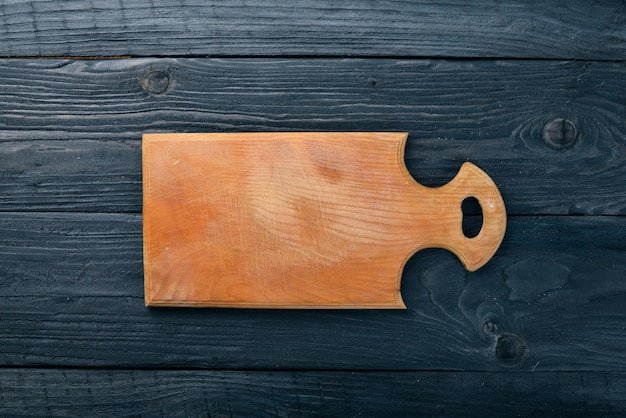 Tavola di legno della cucina Su uno sfondo di legno Vista dall'alto Spazio libero per il testo