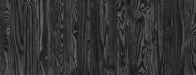 Tavole di legno nere, un panorama della struttura in legno con motivi naturali