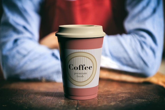 Tazza da caffè con coperchio su una barra di legno con un'immagine sfocata del barista come sfondo illustrazione 3d