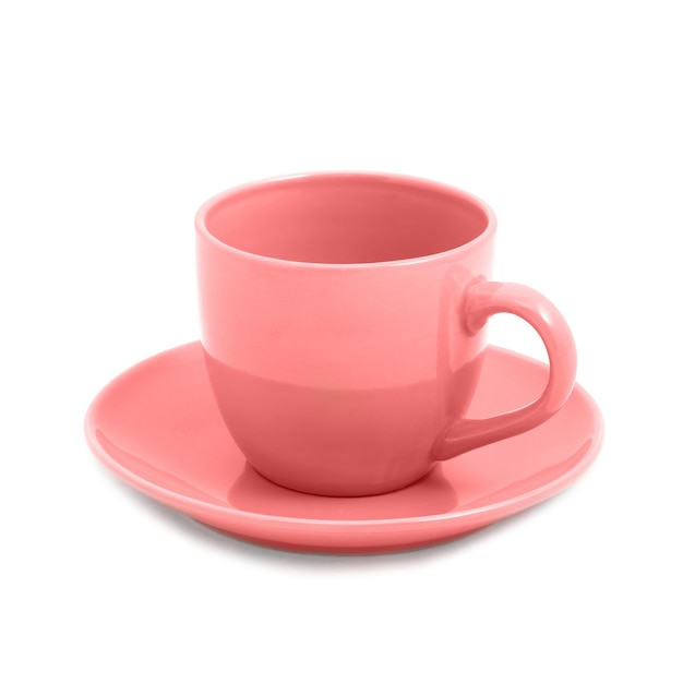 Tazza da tè rosa e piattino isolati