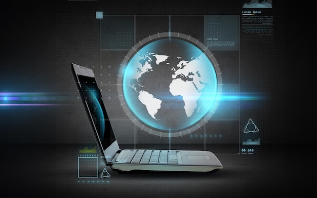 technology, business, mass media and internet concept - open laptop computer with globe projection over dark gray background