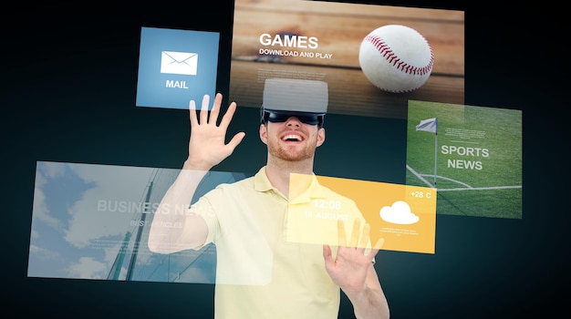 Tecnologia 3d, realtà virtuale, cyberspazio, intrattenimento e concetto di persone - giovane felice con cuffie per realtà virtuale o occhiali 3d e menu delle applicazioni su sfondo nero
