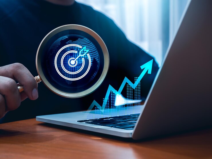 Foto tecnologia dell'intelligenza artificiale tendenze globali marketing digitale ricerca d'affari investimento concetto online icona target con grafica del mondo in lente di ingrandimento in mano hologramma di grafica di crescita su computer portatile