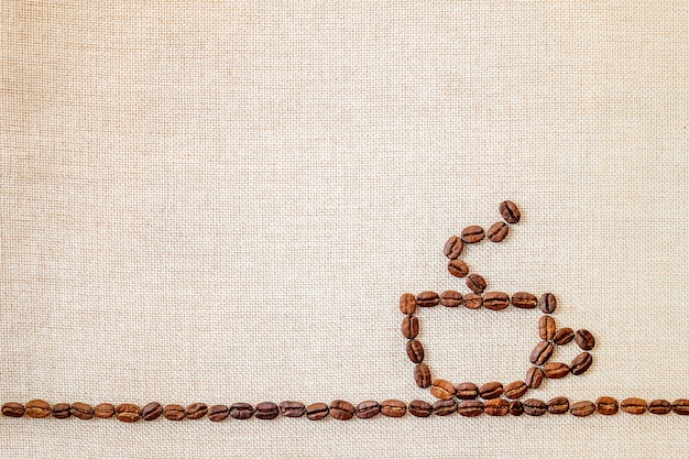 Tela e chicchi di caffè che fanno un pareggio