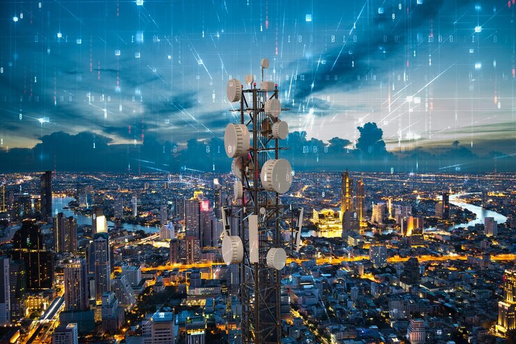 Telecommunication tower with 5G cellular network antenna on night city background Digital big data concept