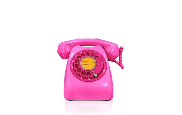 Telefono da tavolo rosa vecchio stile isolato su sfondo bianco