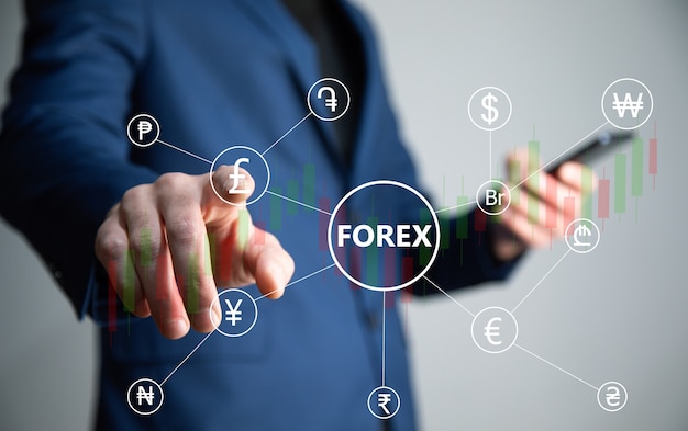 Telefono della mano del commerciante finanziario con forex. Concetto di Forex