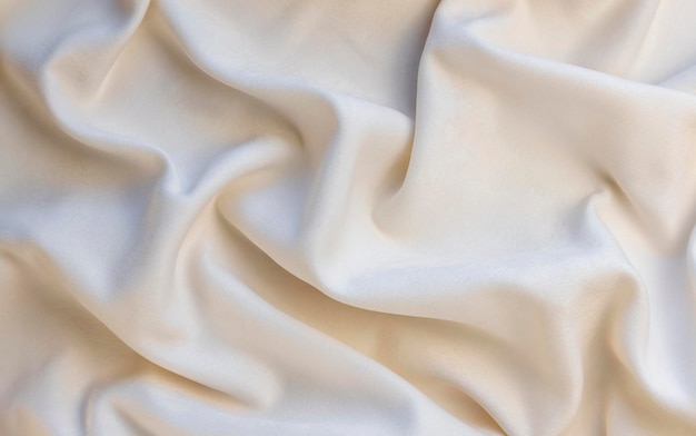 Tessile e concetto di texture primo piano di tessuto stropicciato sfondo Vista dall'alto Tessuto di lusso o pieghe ondulate grunge texture carta da parati elegante design sfondo tessuto beige