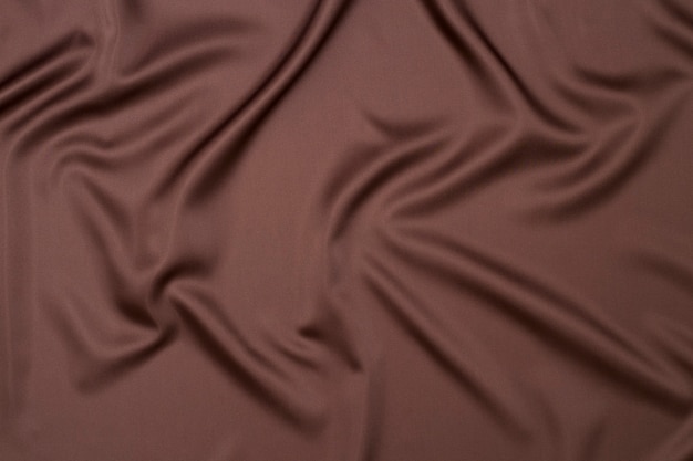 Tessili uno sfondo astratto fatto di tessuto color cioccolato
