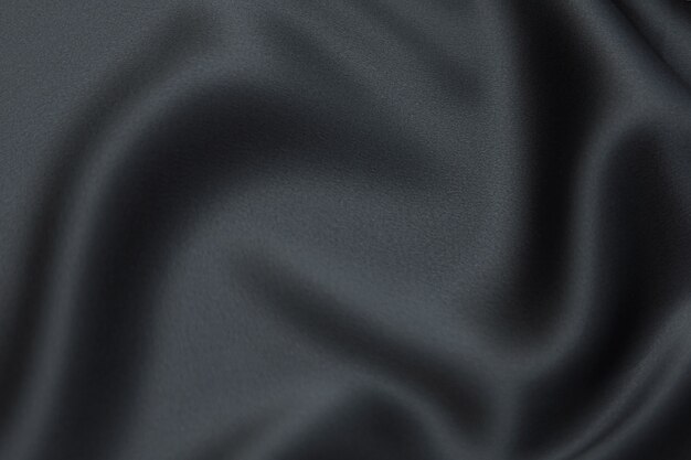 Tessuto in seta o cotone. Colore grigio scuro o nero. Trama, sfondo, motivo.
