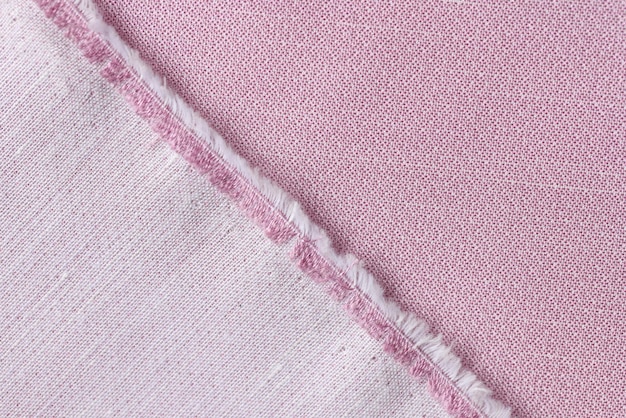 Tessuto rosa tagliato da vicino come faccia di sfondo e lato posteriore del tessuto rosa