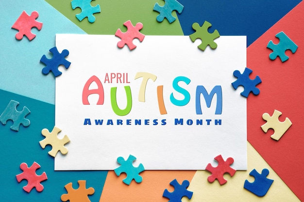 Testo Aprile World Autism Awareness Month telaio con pezzi di puzzle Banner sfondo sfondo per poster volantino per campagna di sensibilizzazione sanitaria per disturbo autistico