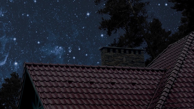 Tetto della casa sotto il cielo blu notturno