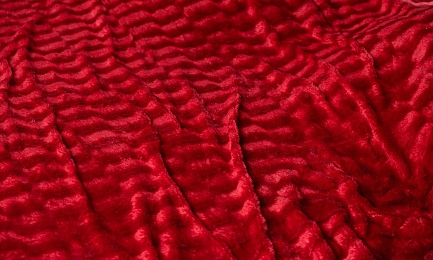 Texture di calda e morbida coperta rossa sullo sfondo di un lungo striscione
