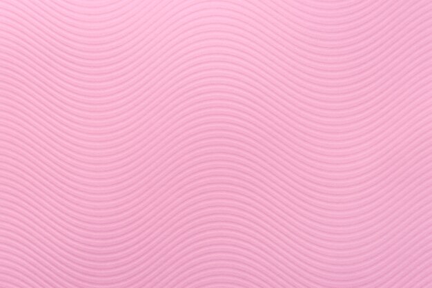 Texture di carta rosa, motivo artistico, onde morbide, strisce, colori delicati, parete ruvida, disegno in rilievo dell'onda curva