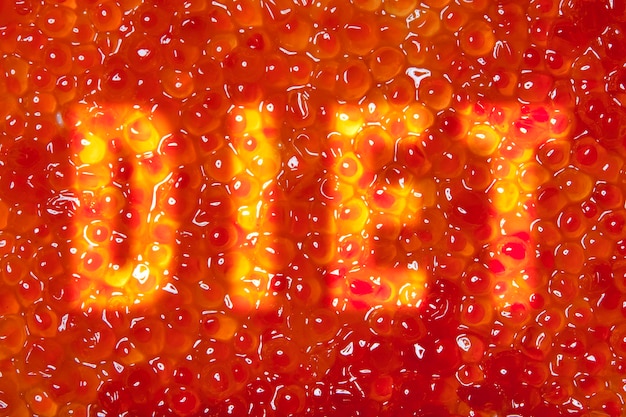 Texture di caviale rosso con la scritta Dieta