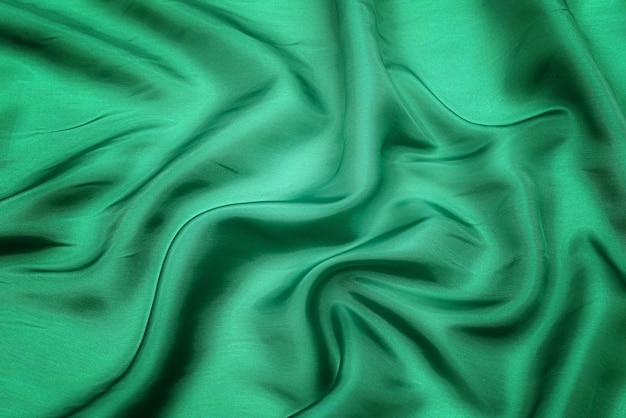 Texture di fondo astratte di tessuto di colore verde naturale Texture di tessuto di cotone naturale o di seta di lino o di lana di satin o di materiale tessile di jersey Sfondi di tela di lusso