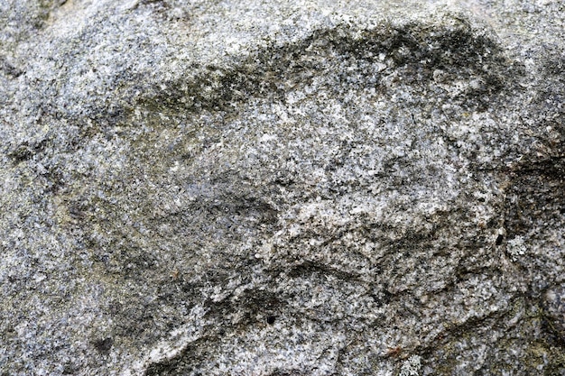 Texture di grigio vecchia pietra dura con crepe urti e pattern di sfondo