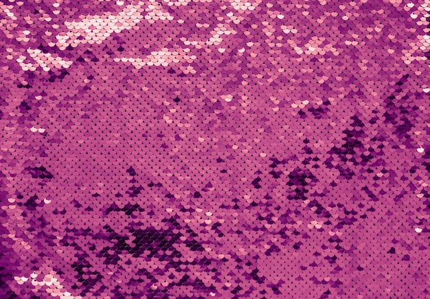 Texture di lusso fatta di paillettes viola. Colori brillanti 2022.