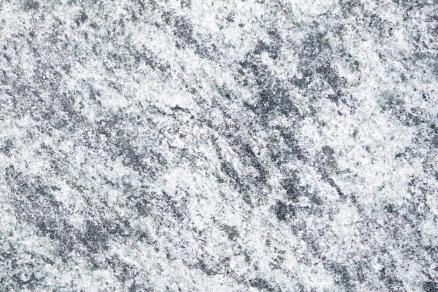 Texture di pietra di granito grigio muro bianco e nero sullo sfondo