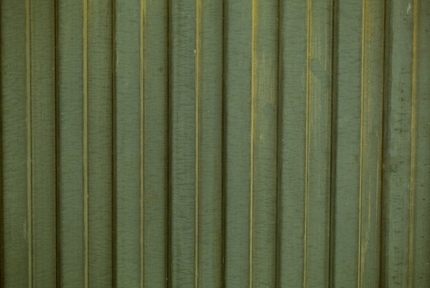 Texture di sfondo del rivestimento verde scanalato decorativo in un motivo verticale ripetuto i