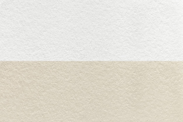 Texture di sfondo di carta beige e bianca artigianale metà due colori macro Struttura di cartone marrone vintage