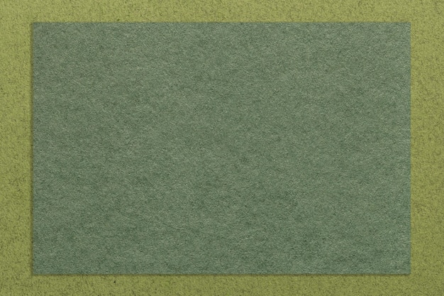 Texture di sfondo di carta di colore verde artigianale con macro bordo oliva Struttura di cartone kaki kraft vintage