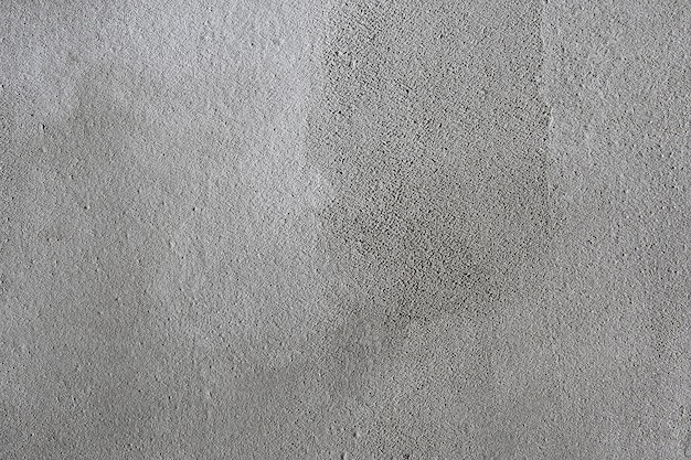 Texture di sfondo grigio intonacato muro grigio, superficie irregolare trattata con cemento