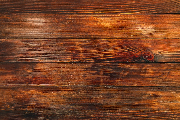 Texture di sfondo in legno marrone vintage con nodi e fori per chiodi