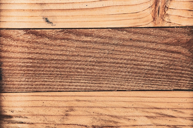 Texture di sfondo in legno marrone vintage con nodi e fori per unghie