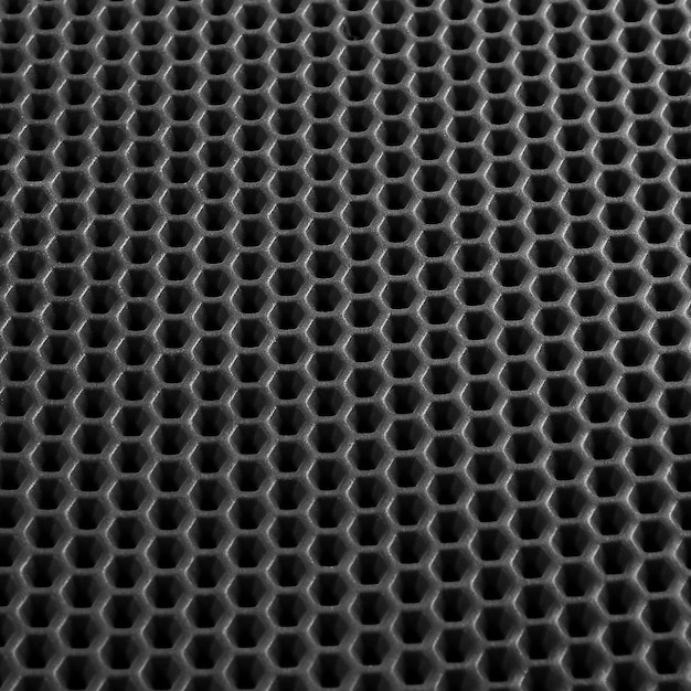 Texture di sfondo in pelle nera con macro motivo a nido d'ape