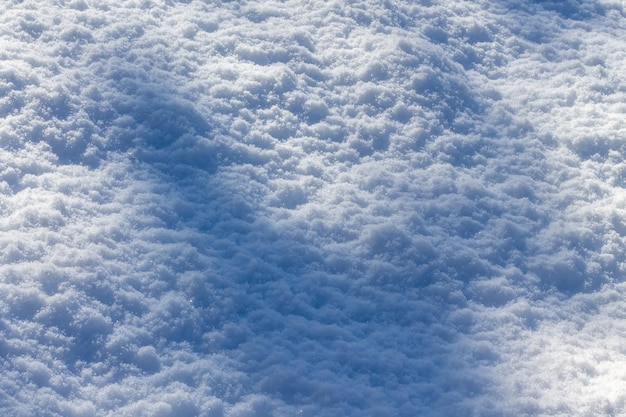 Texture di sfondo neve invernale con primo piano ombra