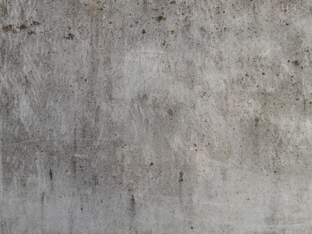 Texture di superficie in cemento grigio ruvido con graffi