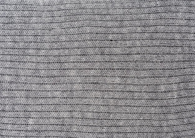 Texture di tessuto a maglia grigio a telaio completo