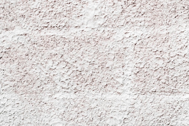 Texture di un grande intonaco grigio su una muratura, primo piano, come uno sfondo
