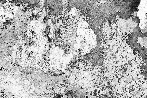 Texture di un muro di cemento con crepe e graffi sullo sfondo