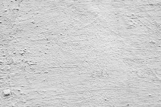 Texture di un muro di cemento con crepe e graffi