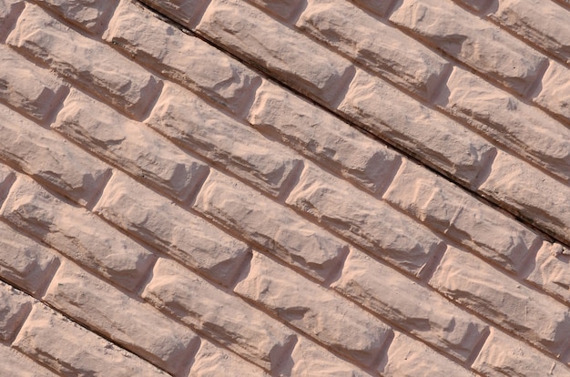 Texture di un muro di cemento in rilievo di colore beige