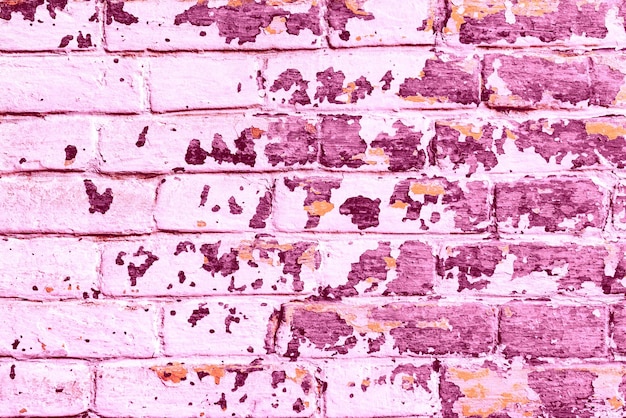 Texture di un muro di mattoni con crepe e graffi che può essere utilizzato come sfondo