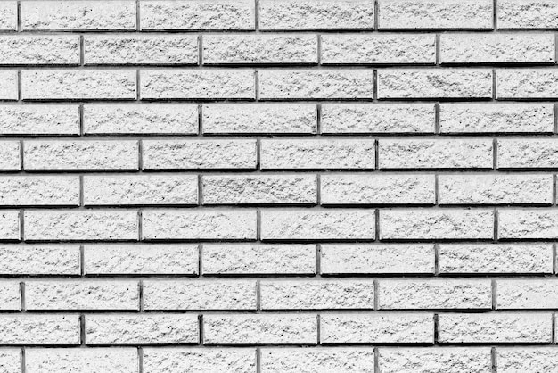 Texture di un muro di mattoni con crepe e graffi che può essere utilizzato come sfondo