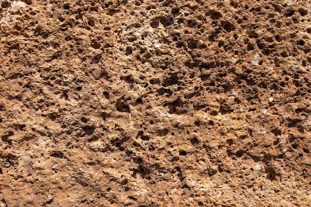 Texture di un muro di pietra. Vecchio fondo antico di struttura della parete di pietra. Muro di pietra come sfondo o trama
