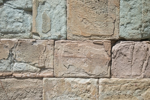 Texture di un muro di pietra. Vecchio fondo di struttura della parete di pietra del castello