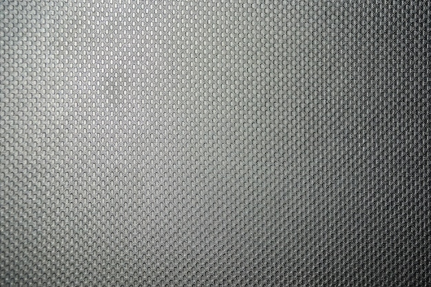 Texture di un panno grigio sintetico, uniformemente illuminato