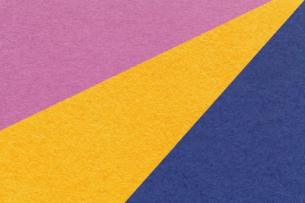 Texture di vecchio artigianato viola giallo e blu navy carta di colore macro di sfondo Vintage cartone lilla astratto