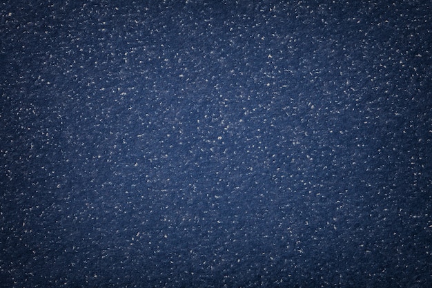 Texture di vecchio primo piano di carta blu navy scuro. Struttura in cartone.