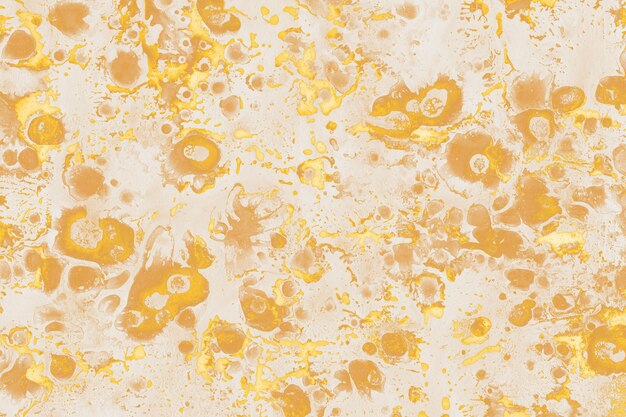 Texture di vernice liquida colorata su uno sfondo di carta bianca