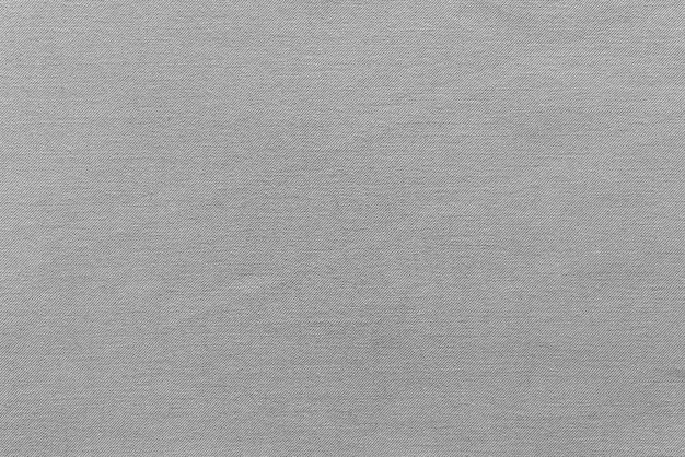 Texture e sfondo di tessuto grezzo o materiale di cotone di colore grigio