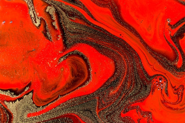 Texture fluida in marmo rosso nero e oro