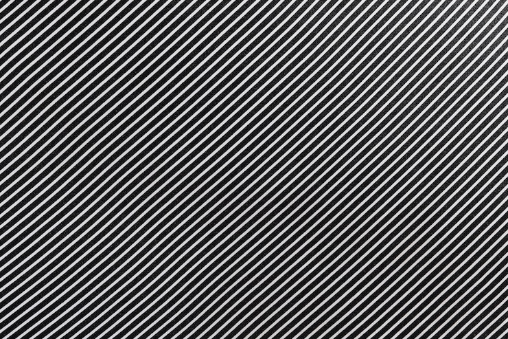 Foto texture ravvicinata di tessuto di seta a righe bianche e nere ad angolo concetto di sartoria immagine per il tuo design