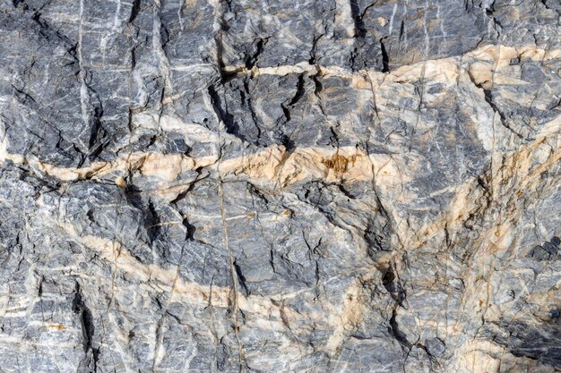 Texture selvaggia naturale pietra eterogenea sfondo di marmo primo piano